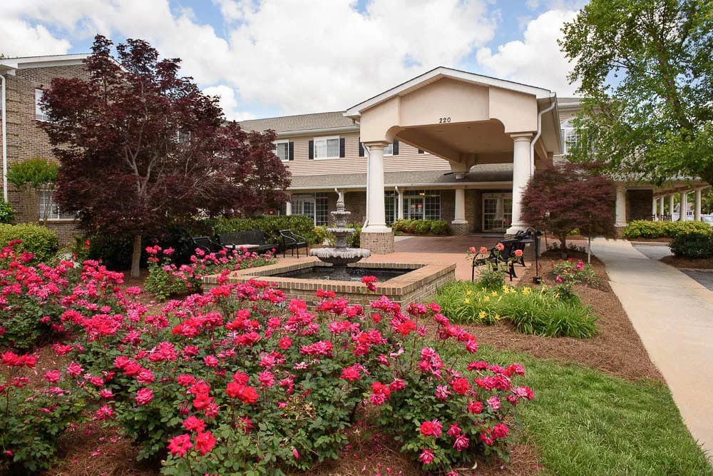 Exterior view of the facility entrance with flowers