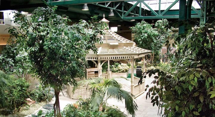 Indoor garden area with gazebo and greenery