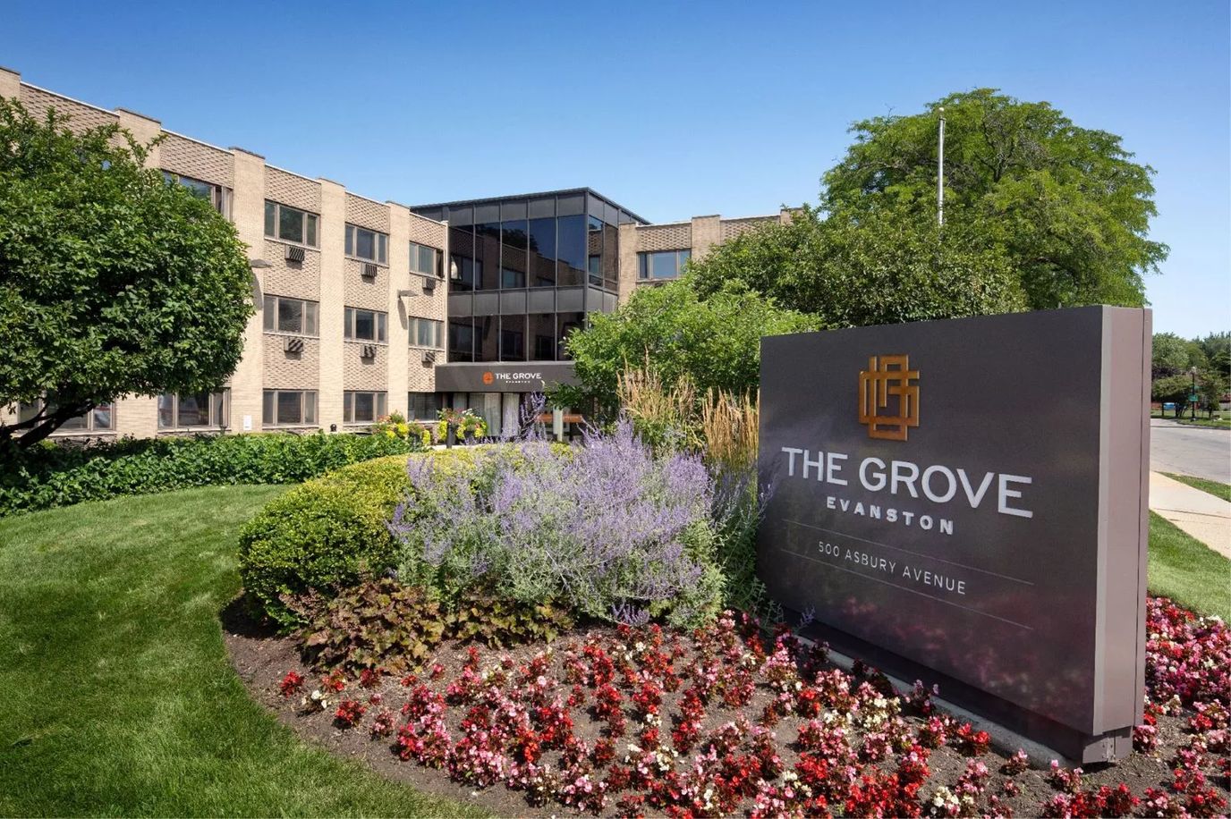 Exterior view of The Grove of Evanston with floral landscaping