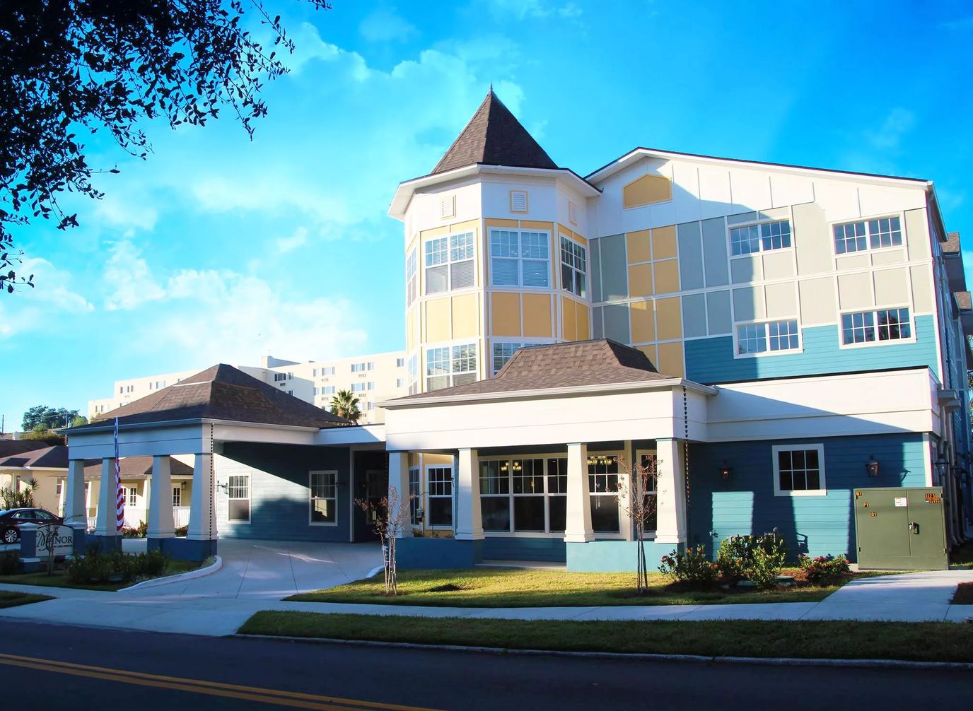 Exterior view of The Manor at Lake Morton with blue and yellow design