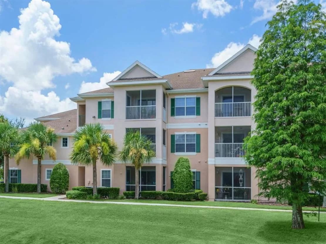 Exterior view of a nursing home building with palm trees