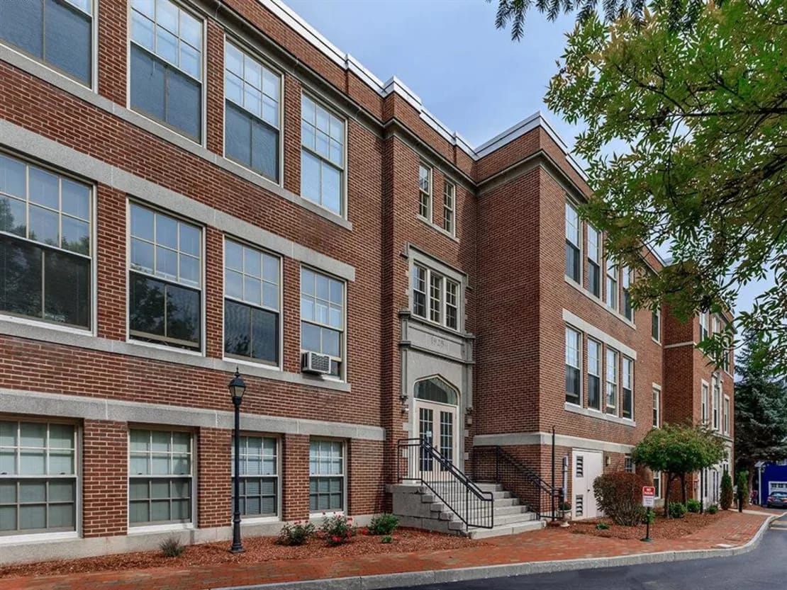 Exterior view of a brick assisted living facility.