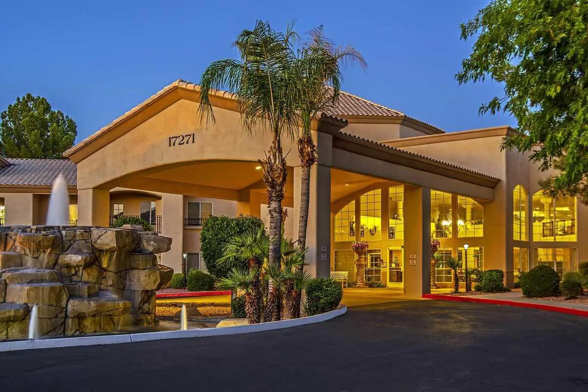 Exterior view of The Montecito Senior Living facility at dusk