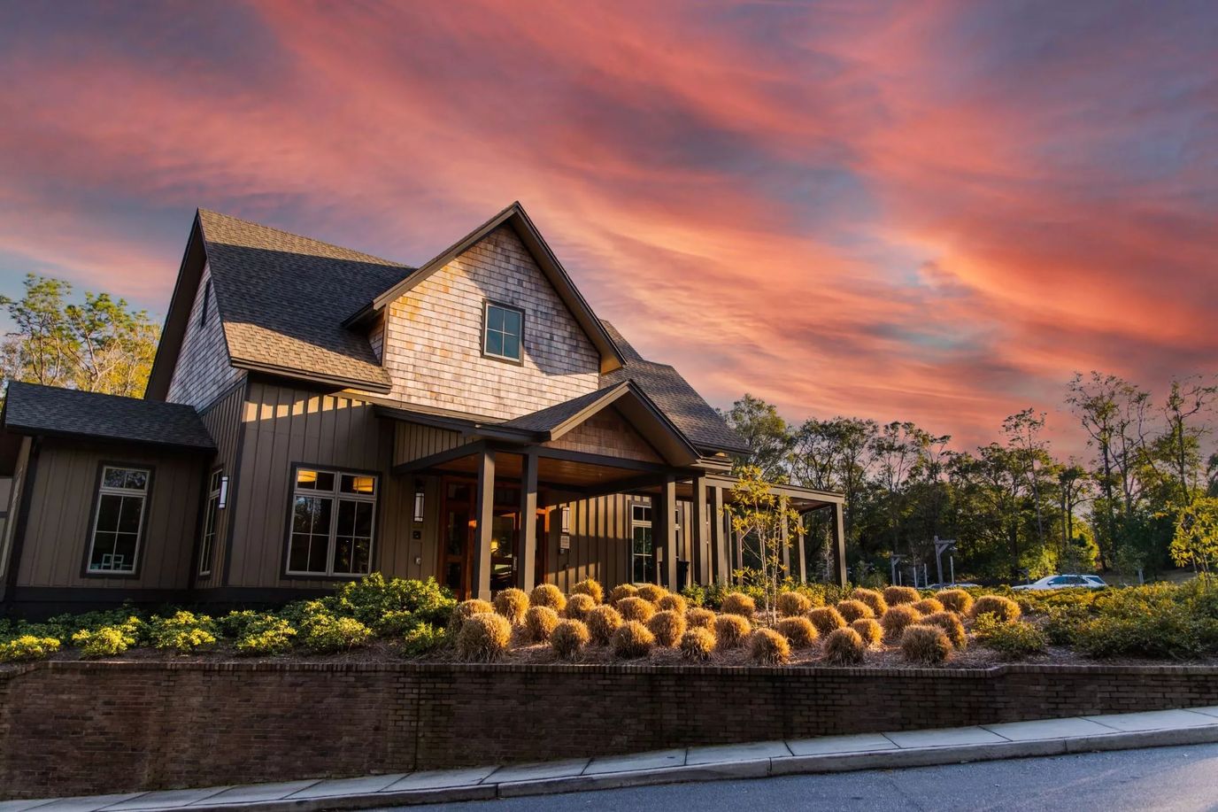 Exterior view of a senior living facility at sunset