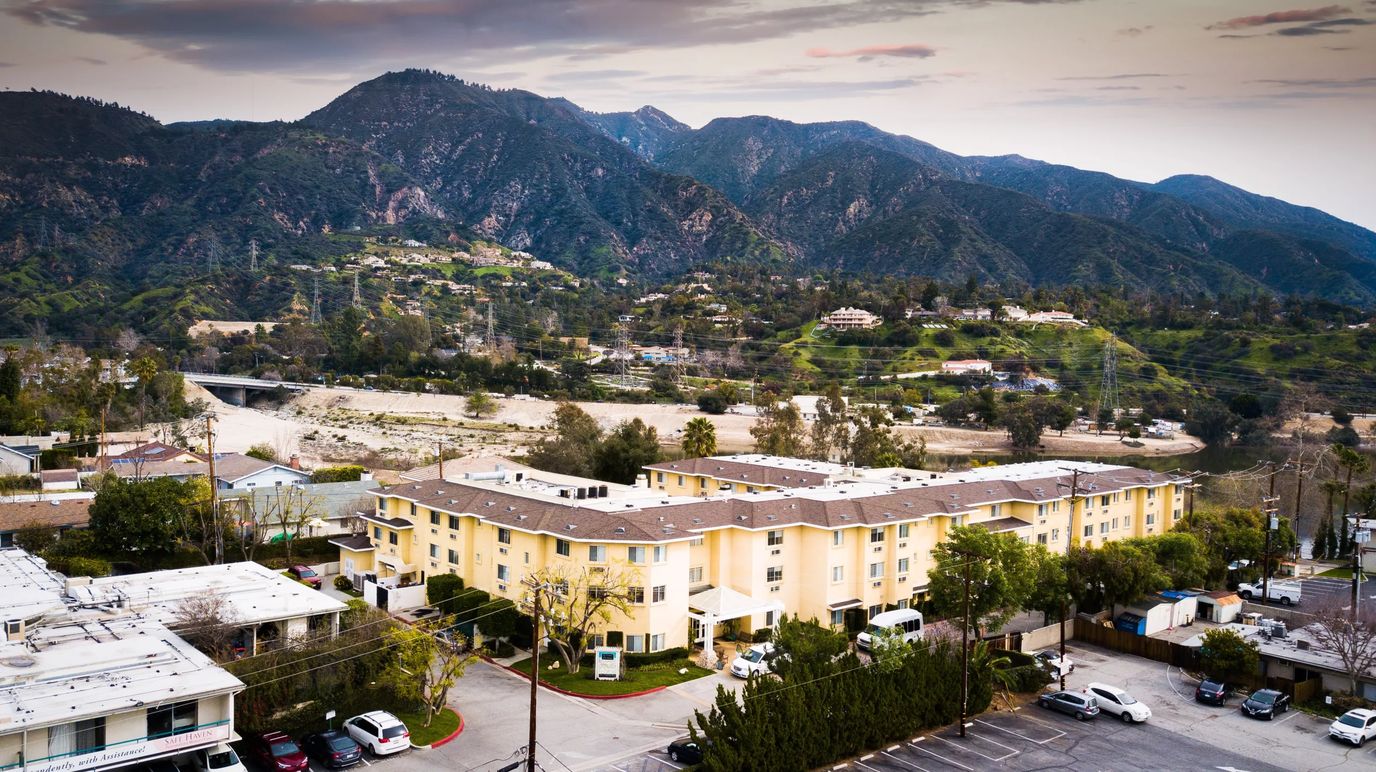Exterior view of the facility with mountains in the background