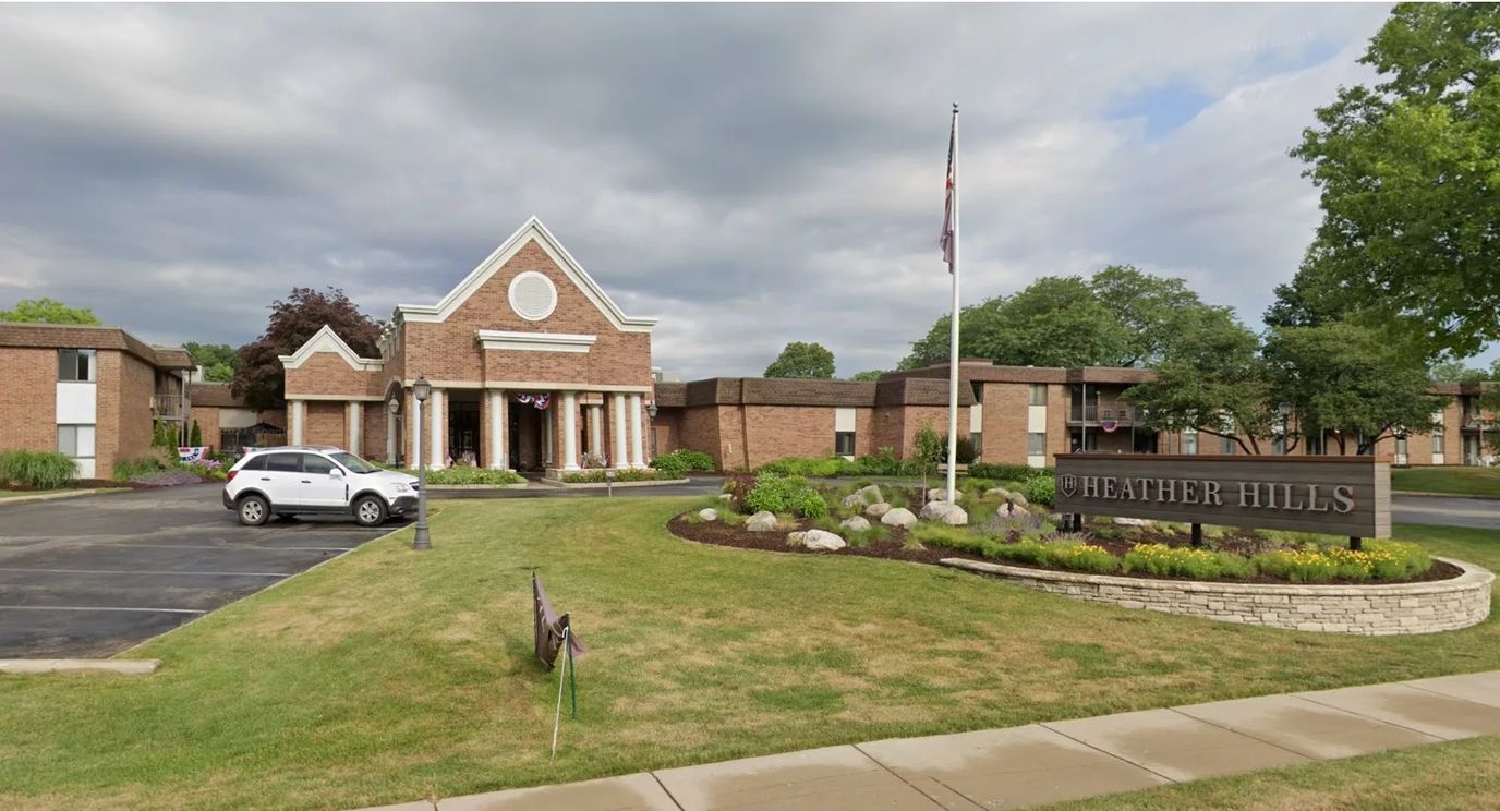 Exterior view of Heather Hills facility with gardens