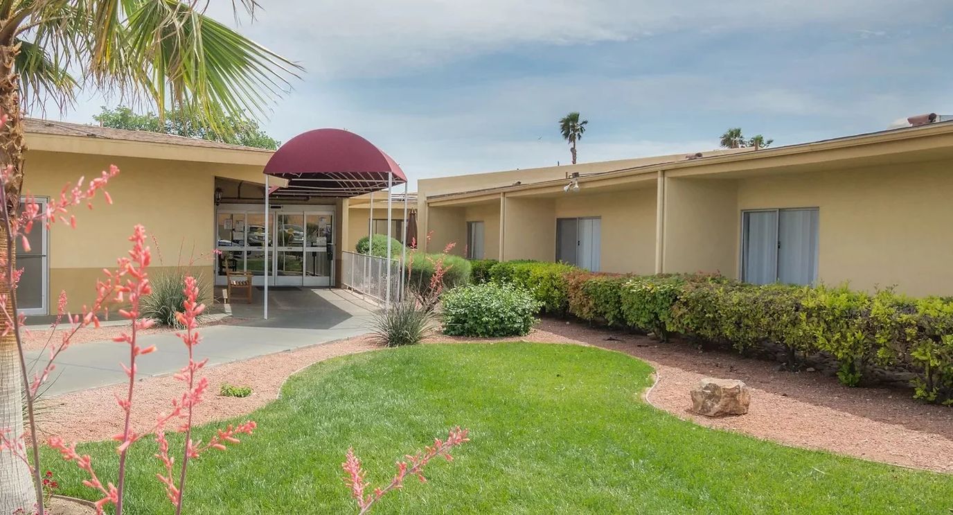 Exterior view of the facility entrance and garden