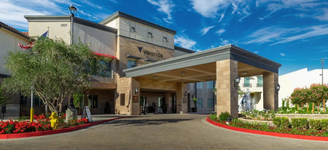 Exterior view of Varenita facility with landscaped entrance