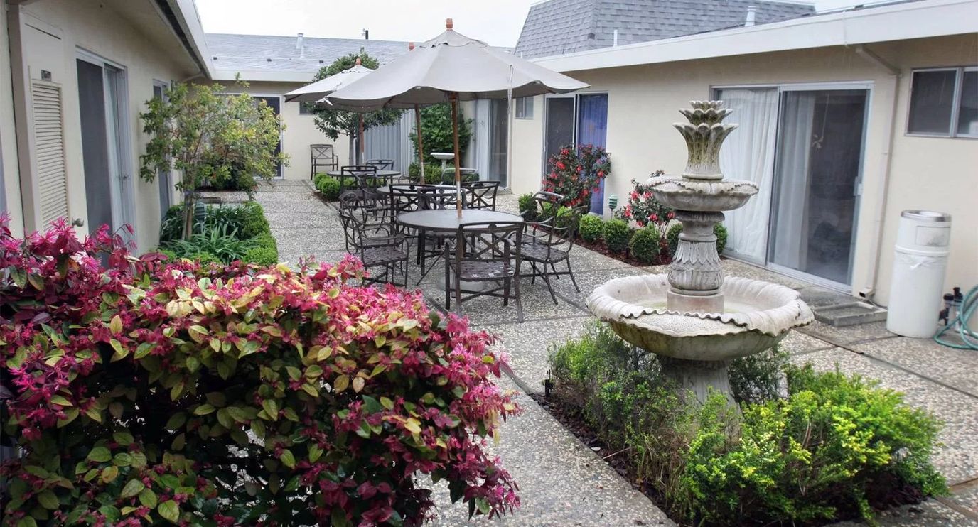 Beautiful garden courtyard with seating and fountain