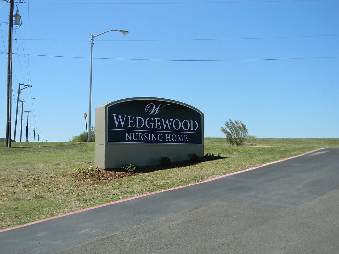 Signage for Wedgewood Nursing Home at the facility entrance