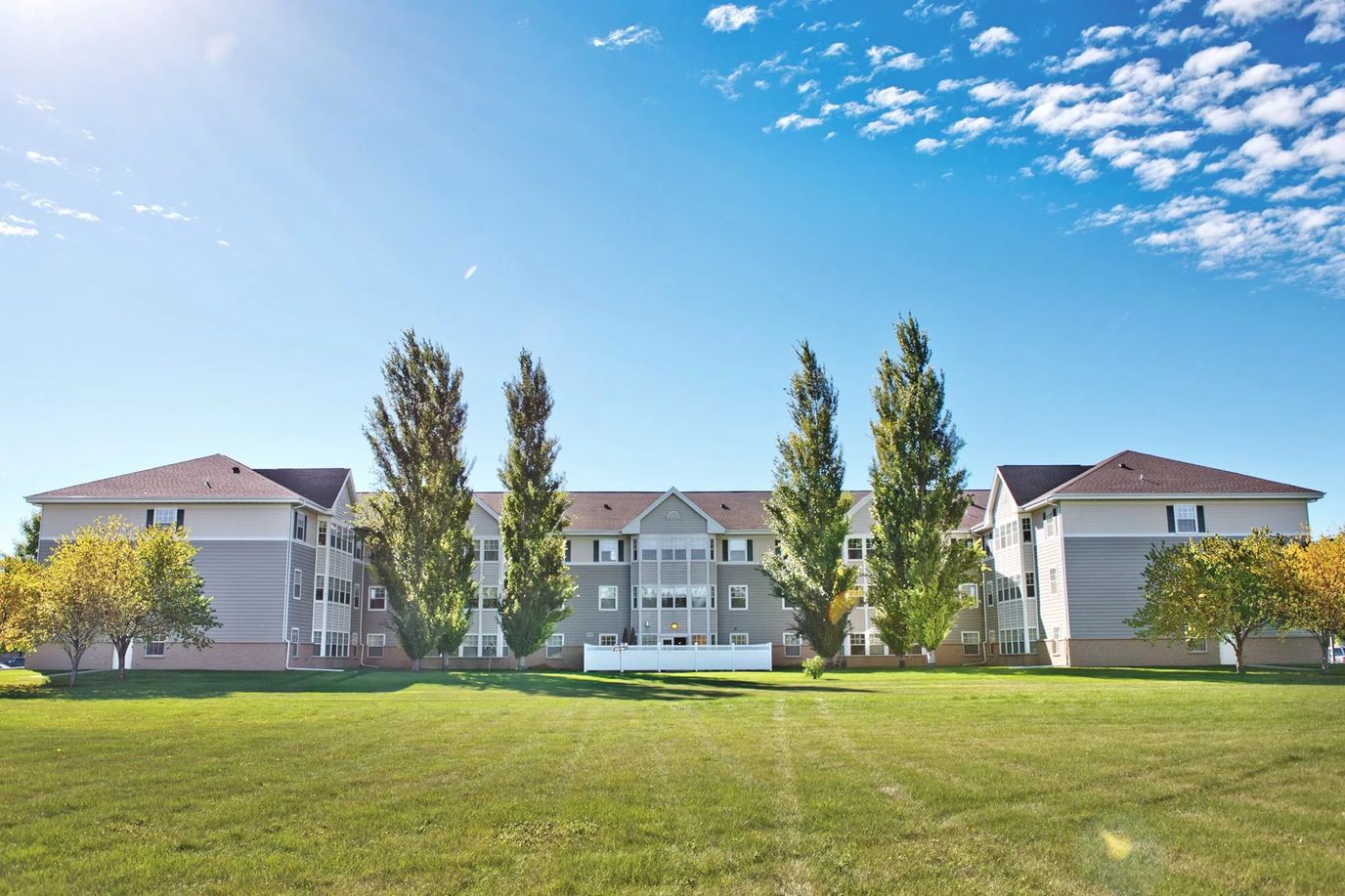 Exterior view of Wheatland Terrace with green lawns