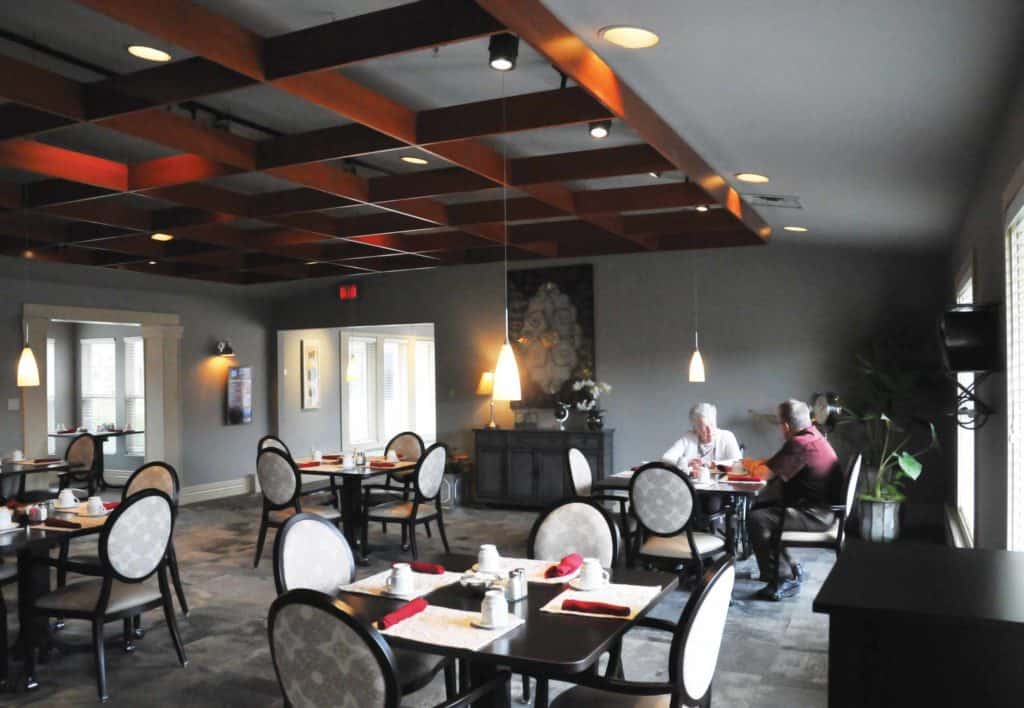 Residents dining in a well-lit dining room