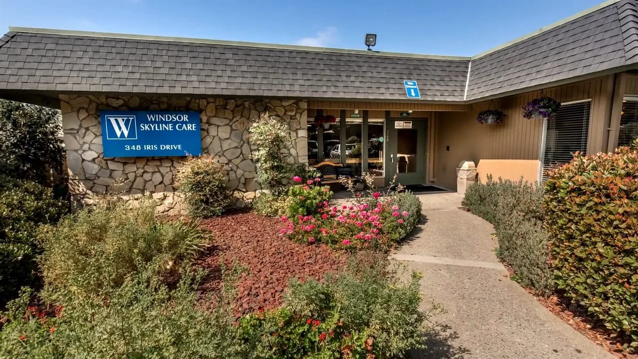 Exterior view of Windsor Skyline Care Center with flowers