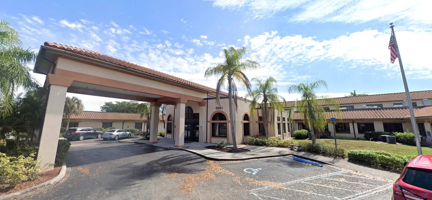 Exterior view of Winkler Court with palm trees