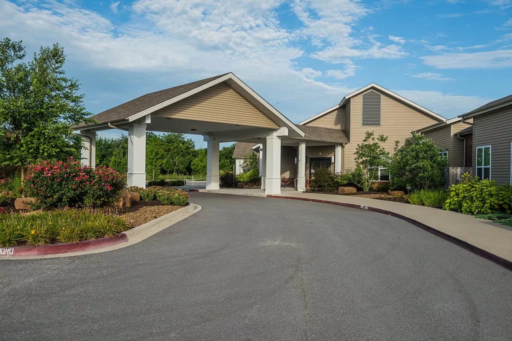 Entrance of a senior living facility with landscaping
