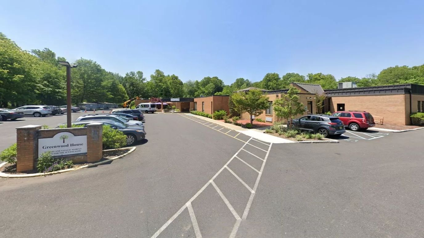 Exterior view of Greenwood House with parking
