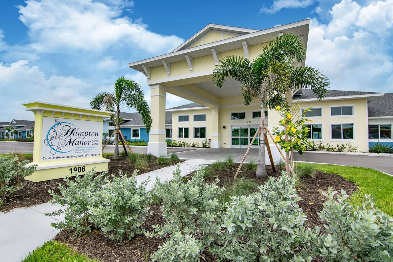 Exterior view of Hampton Manor with landscaped entryway