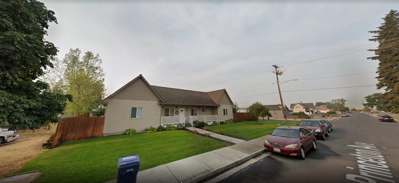 Exterior view of a senior living facility in a suburban area