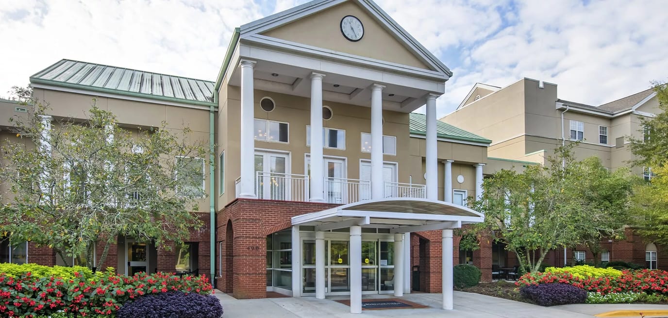 Exterior view of Brookdale University Park entrance with flowers