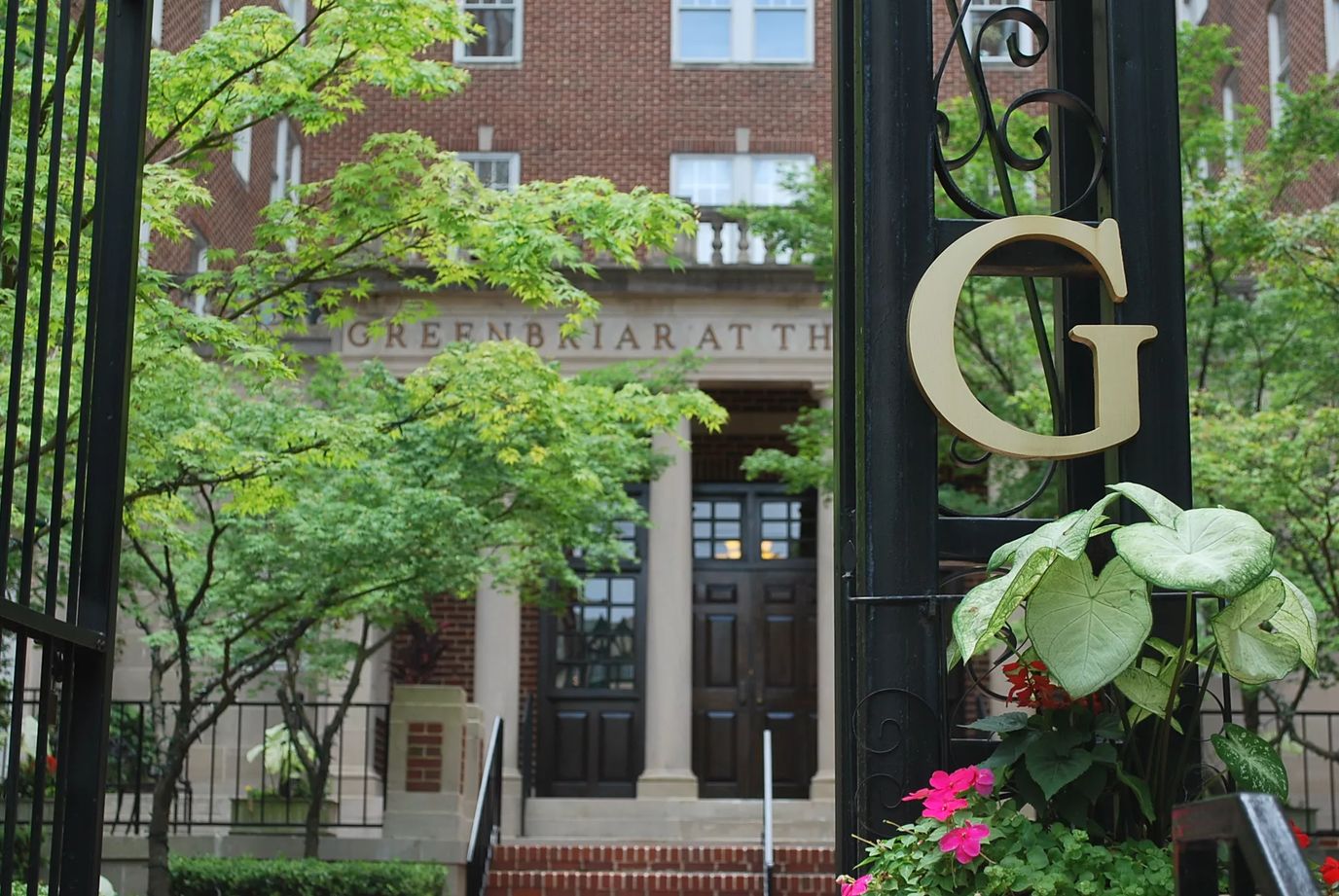 Entrance of Greenbriar at the Altamont with signage and greenery