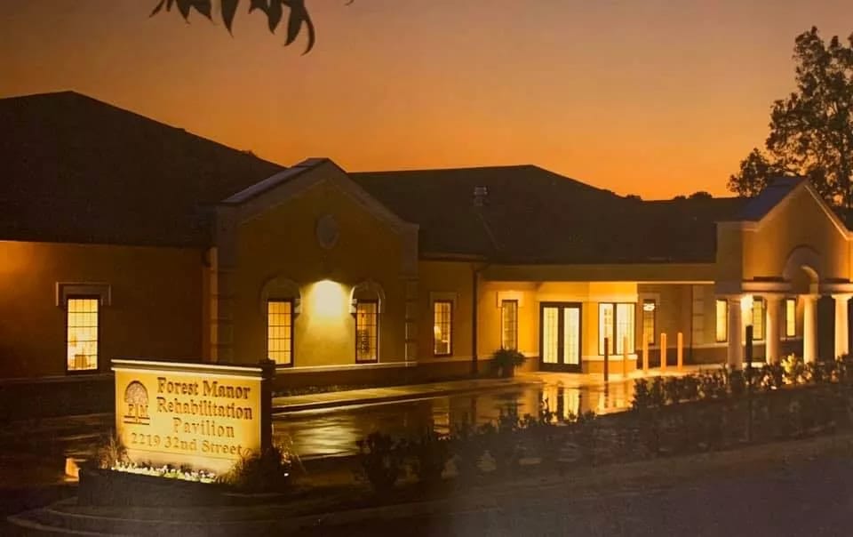 Exterior view of Forest Manor at sunset