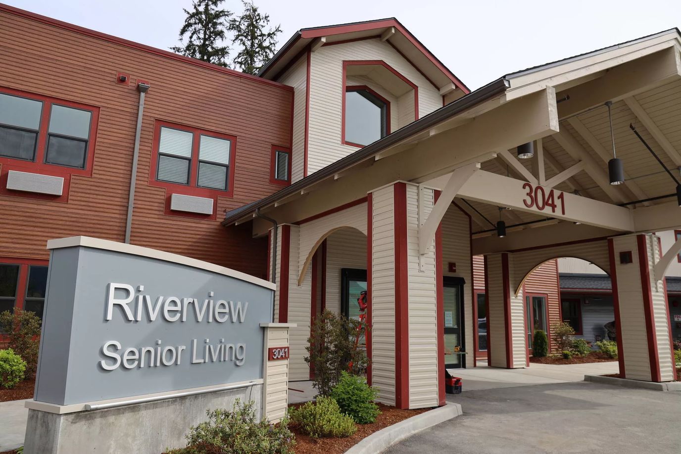 Exterior view of Riverview Senior Living building entrance.