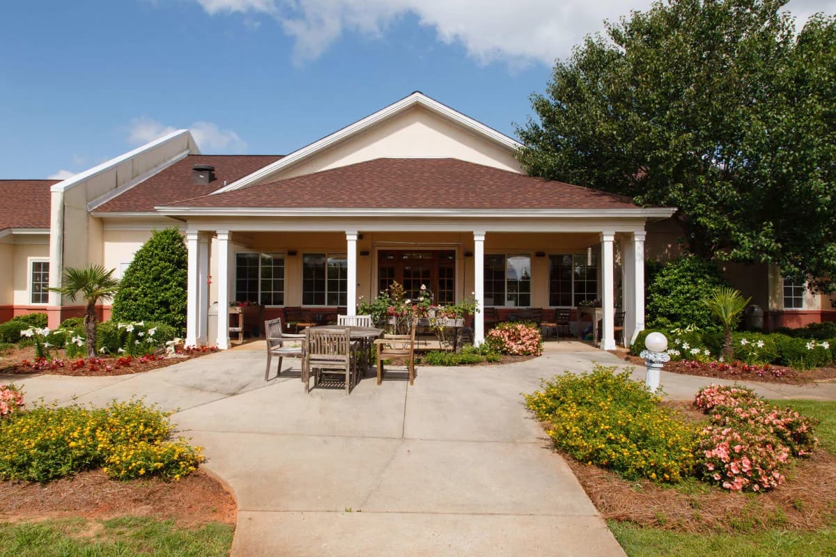 Exterior view of the main entrance with seating and landscaping