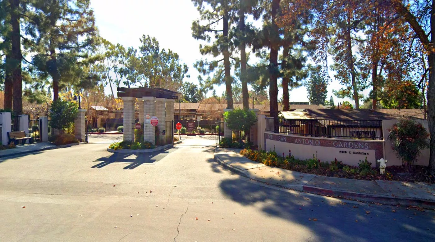 Entrance gate of Harrison Villa surrounded by trees