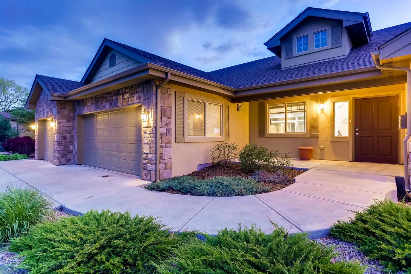 Exterior view of a well-lit assisted living facility