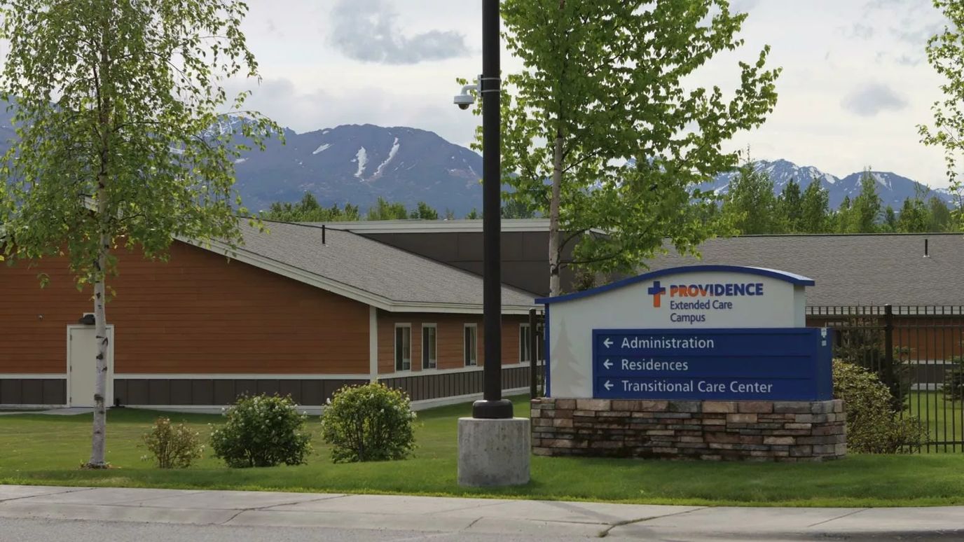 Exterior view of Providence Transitional Care Center with signage
