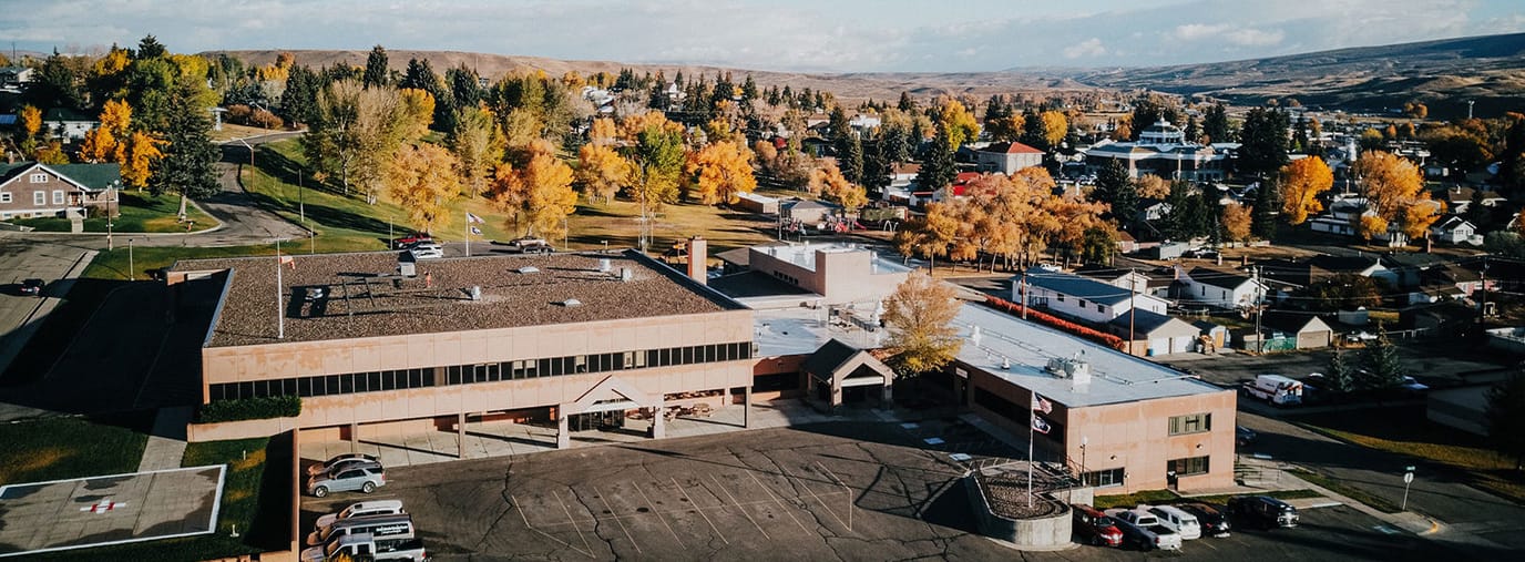 Aerial view of South Lincoln Nursing Center with surrounding trees