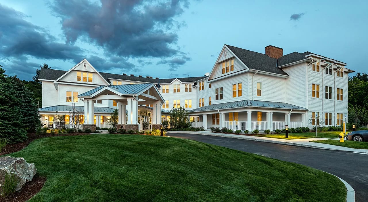 Exterior view of Stone Hill at Andover at dusk