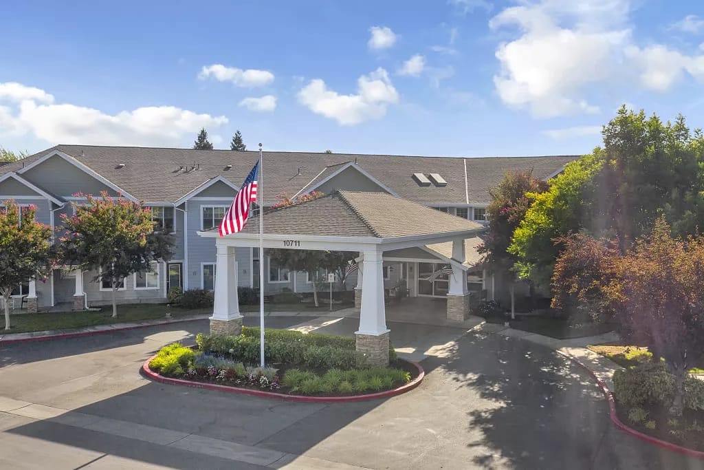 Exterior view of The Commons on Thornton with an American flag