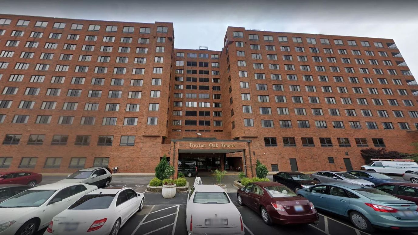 Exterior view of Treyton Oak Towers with parking