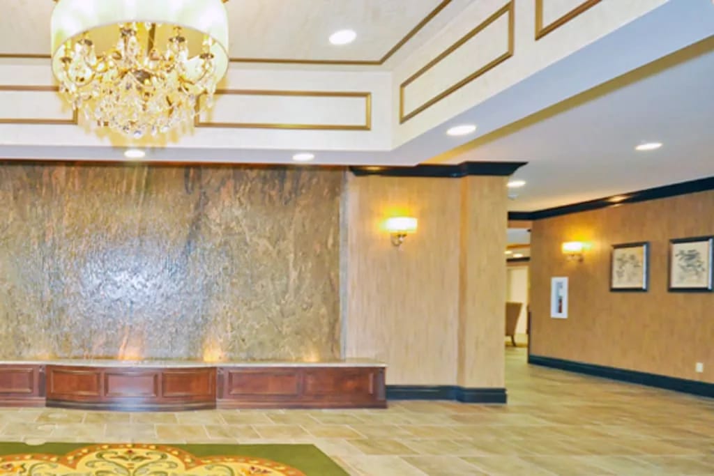 Elegant lobby with a chandelier and water feature