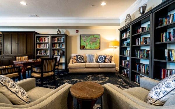 Cozy common area with bookshelves and seating