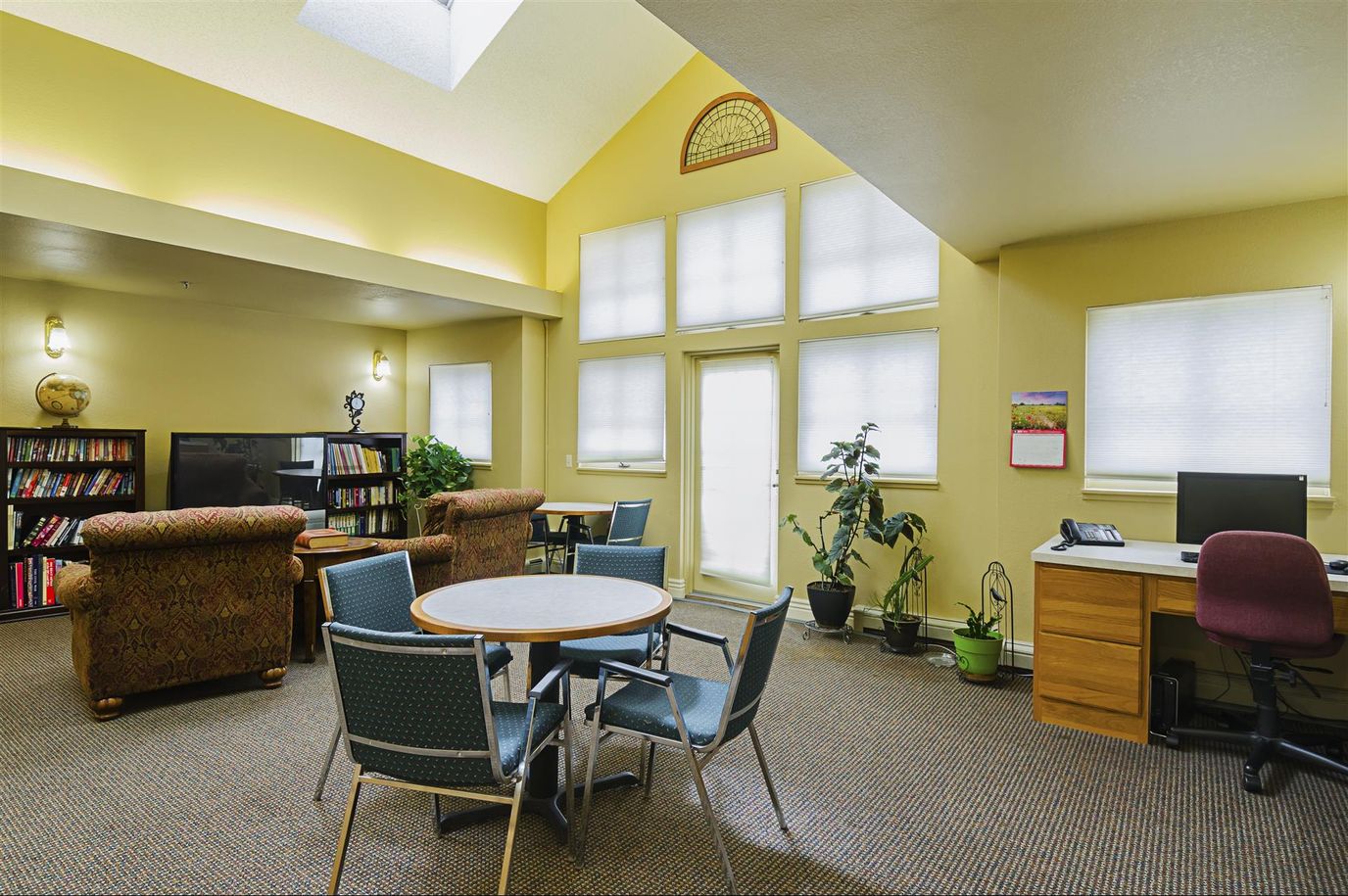 Common area with seating and a bookshelf