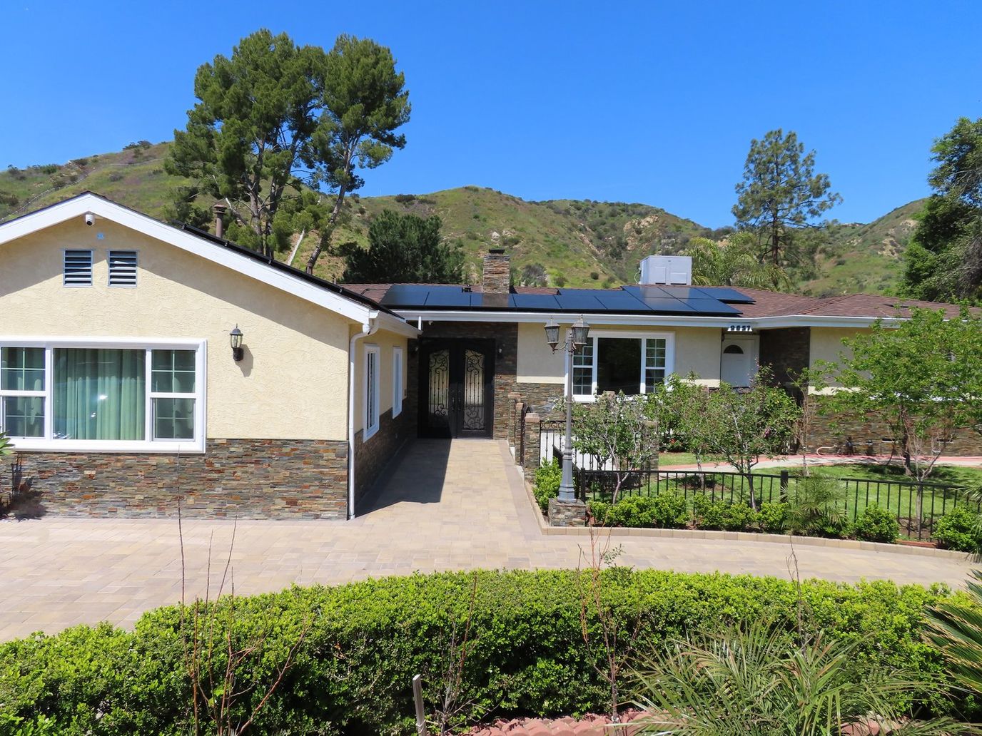 Exterior view of A&A Assisted Living Home with landscaping