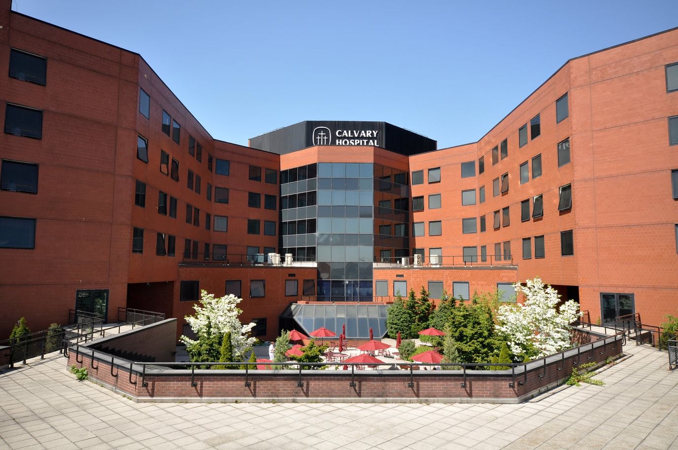 Exterior view of Calvary Hospital with landscaped courtyard