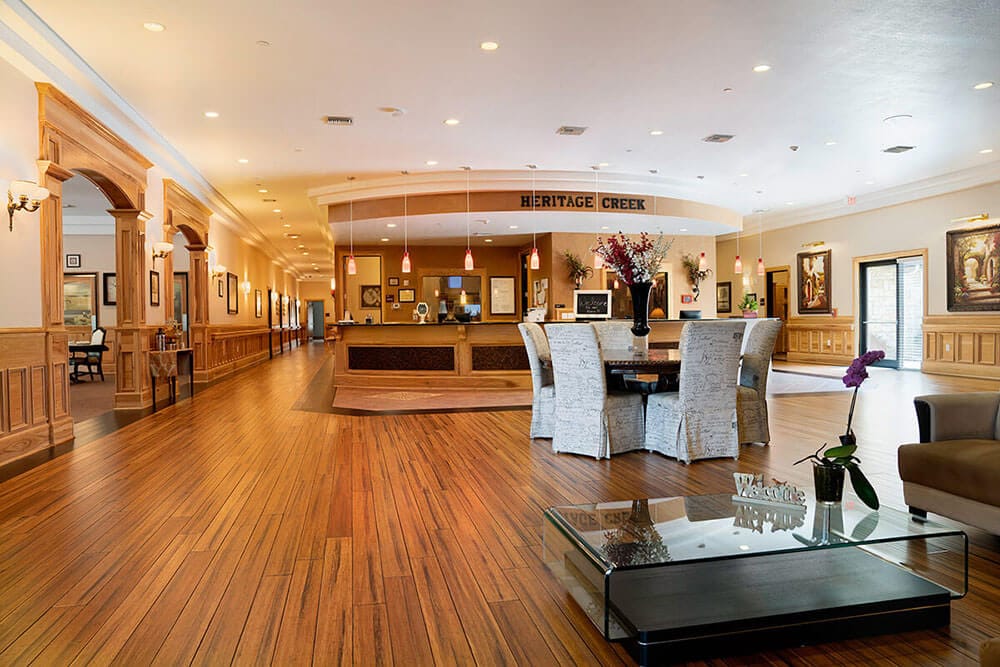 Spacious lobby of Heritage Creek with seating and reception area.