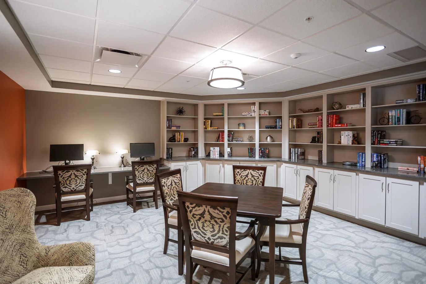 Cozy library with bookshelves and computers