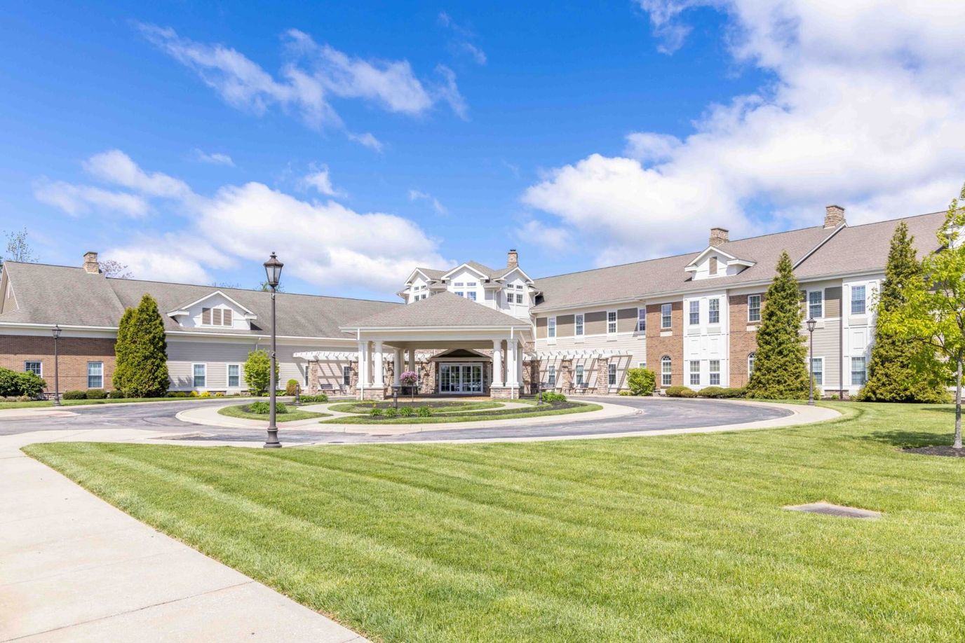 Exterior view of the facility with landscaped grounds