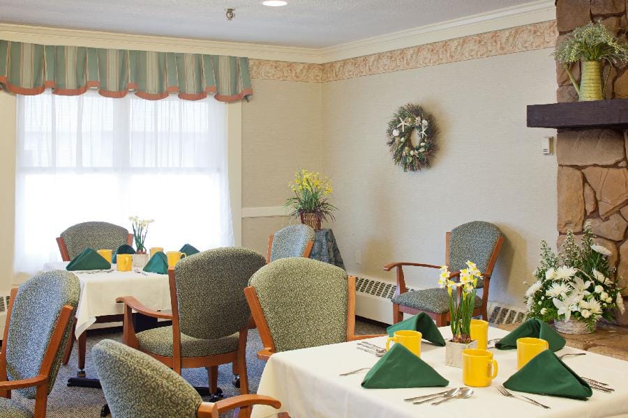 Dining area with tables set for residents