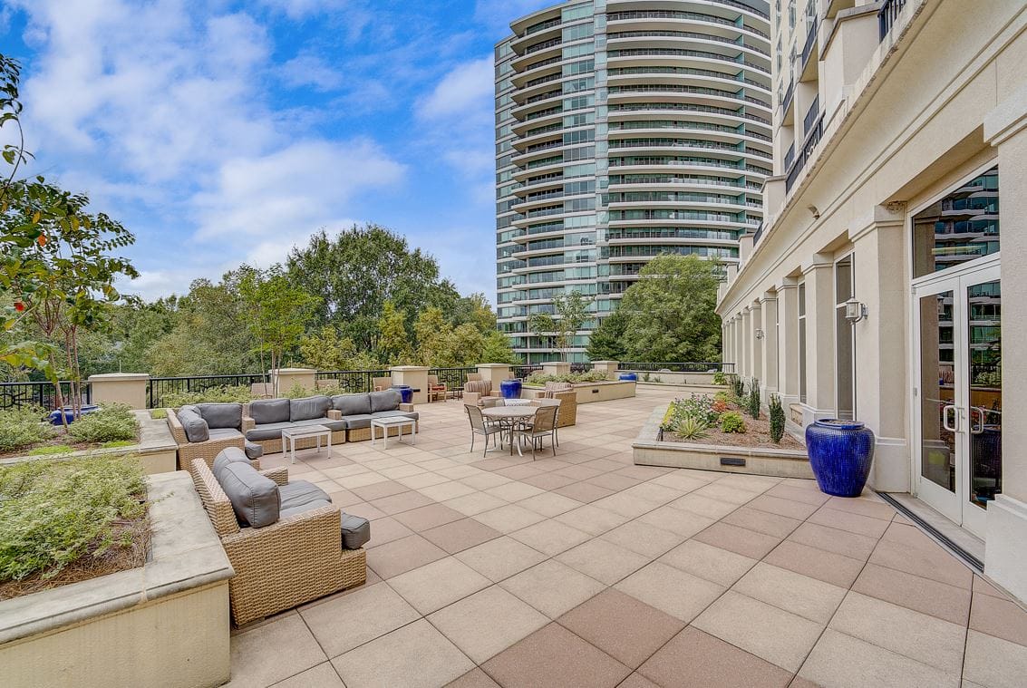Outdoor terrace with seating and landscaping