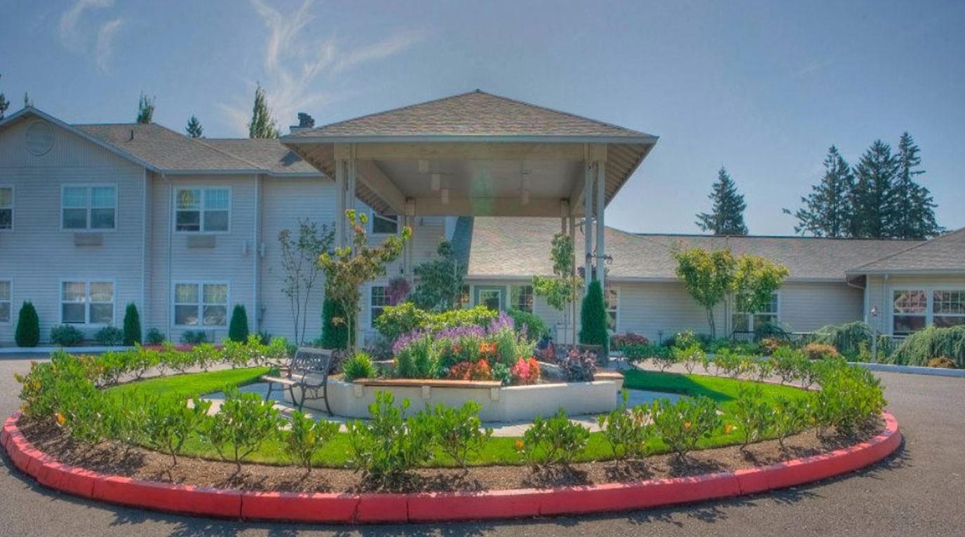 Exterior view of Tanner Spring Assisted Living building and garden