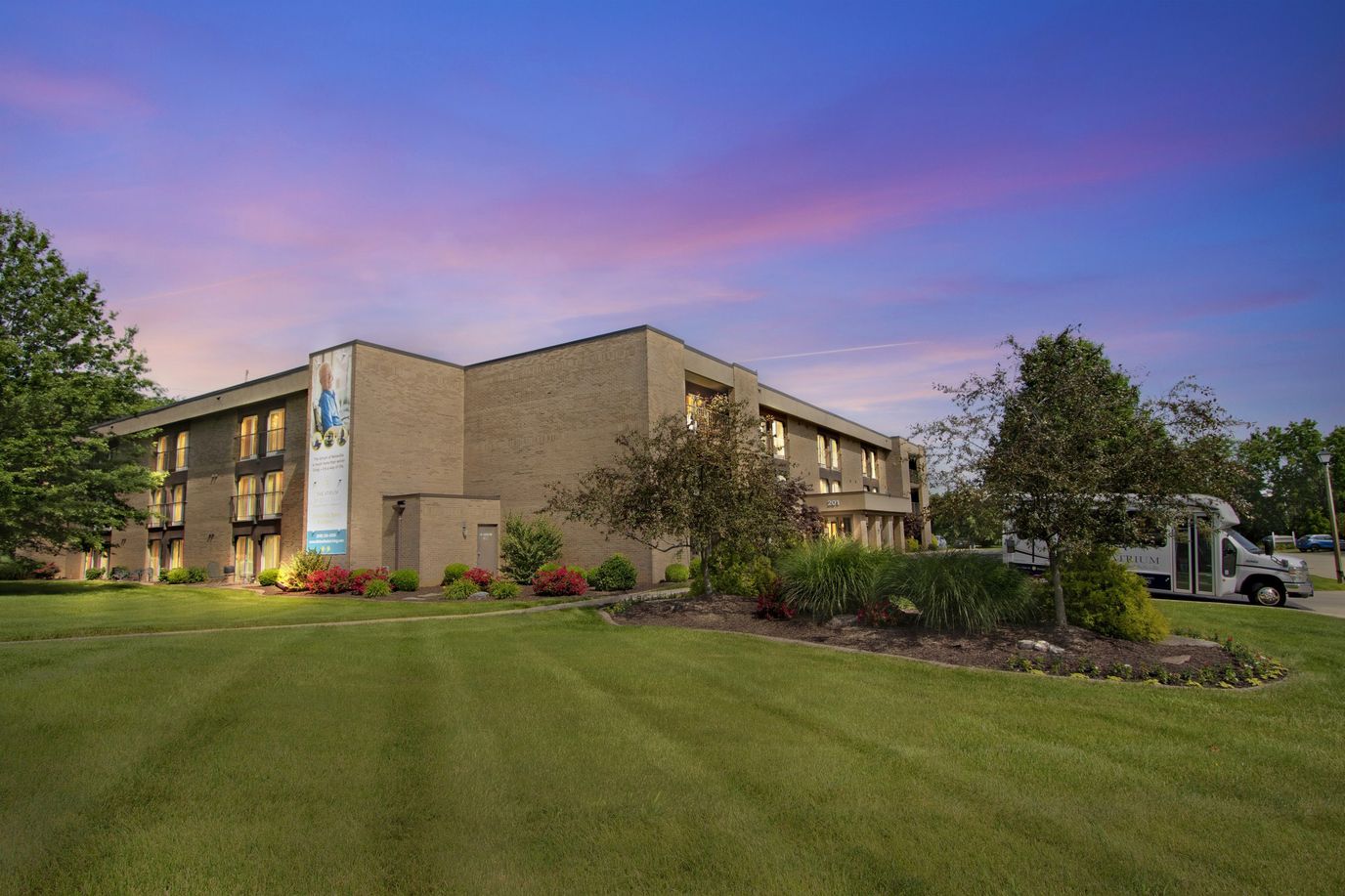Exterior view of The Atrium of Belleville with landscaped area