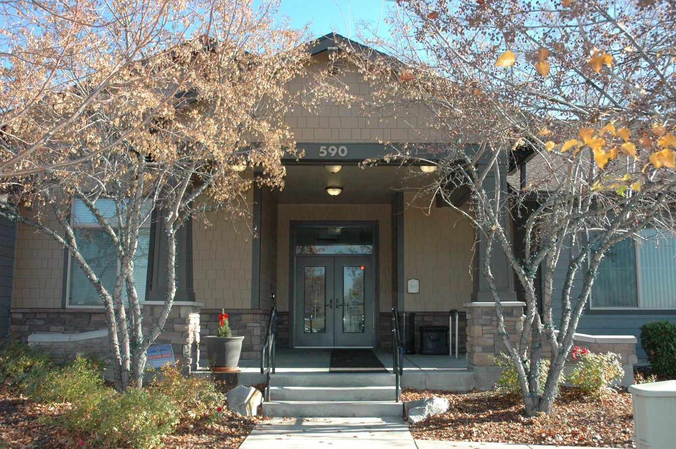 Front entrance of the Touchmark facility with autumn foliage
