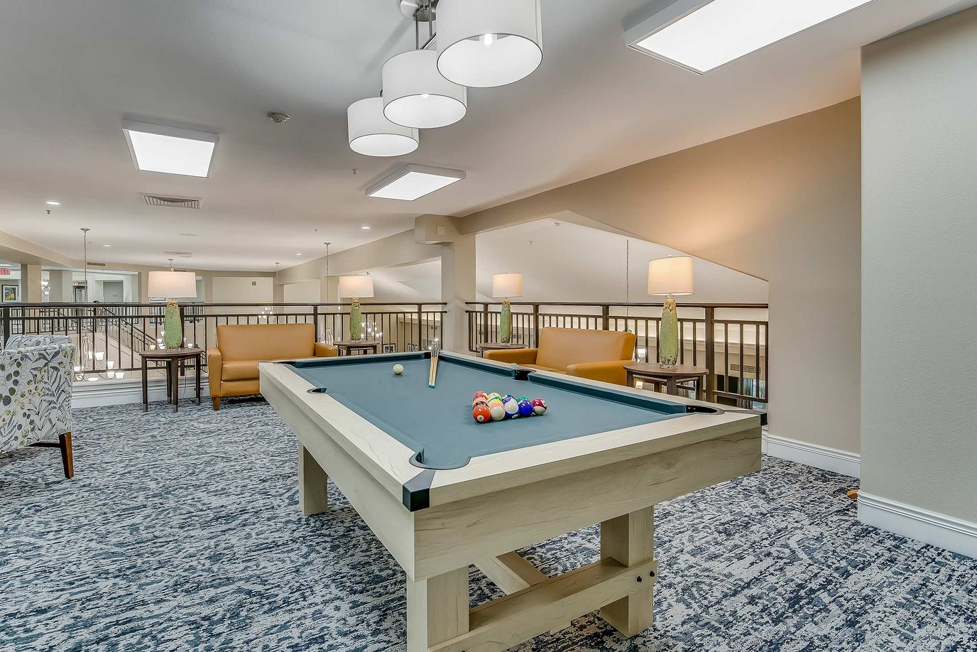 Interior view of a common area with a pool table