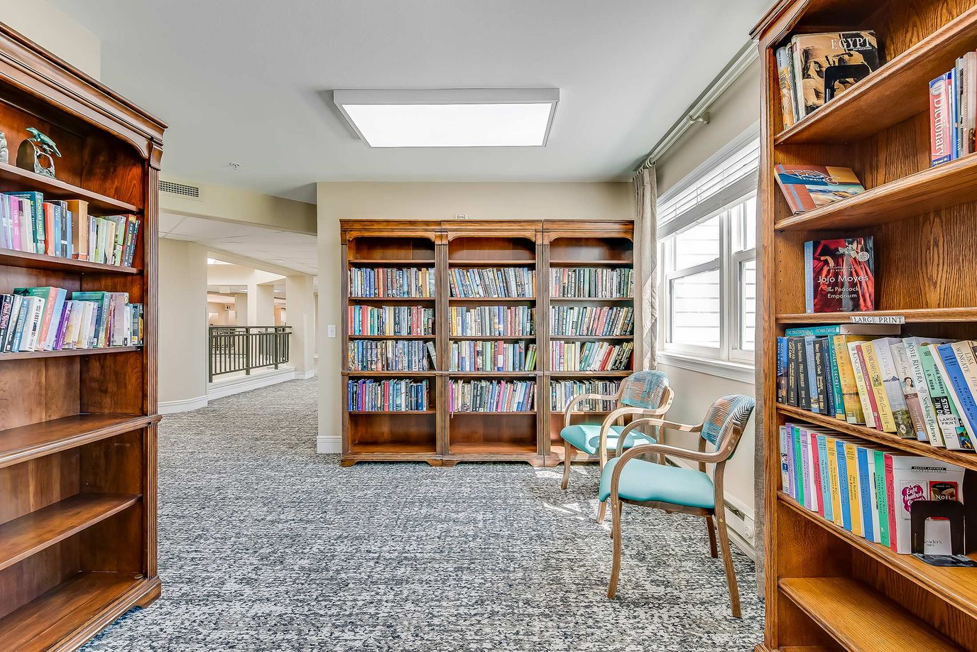 Cozy reading nook with bookshelves and seating