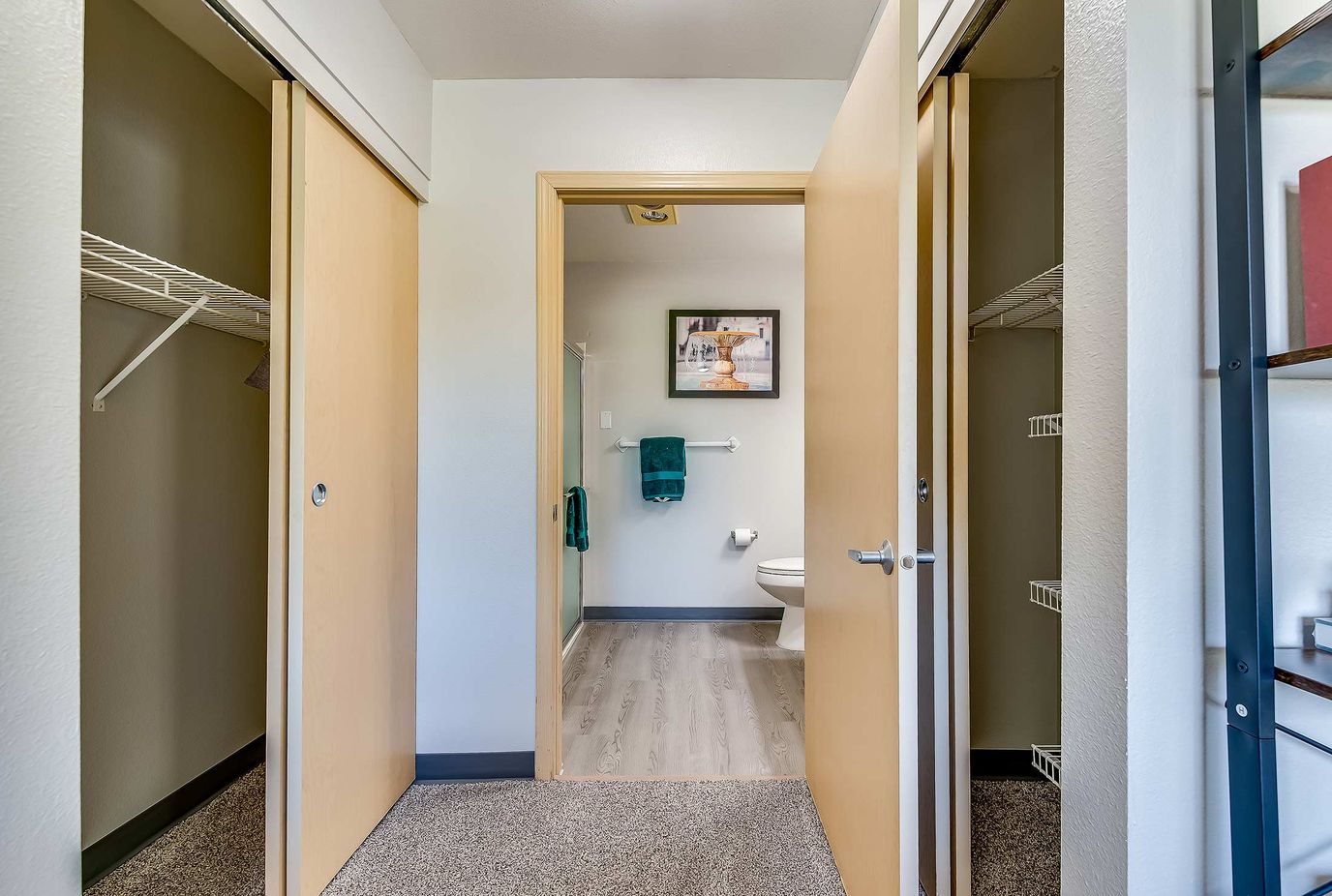 Interior view of a resident's bathroom and closet area